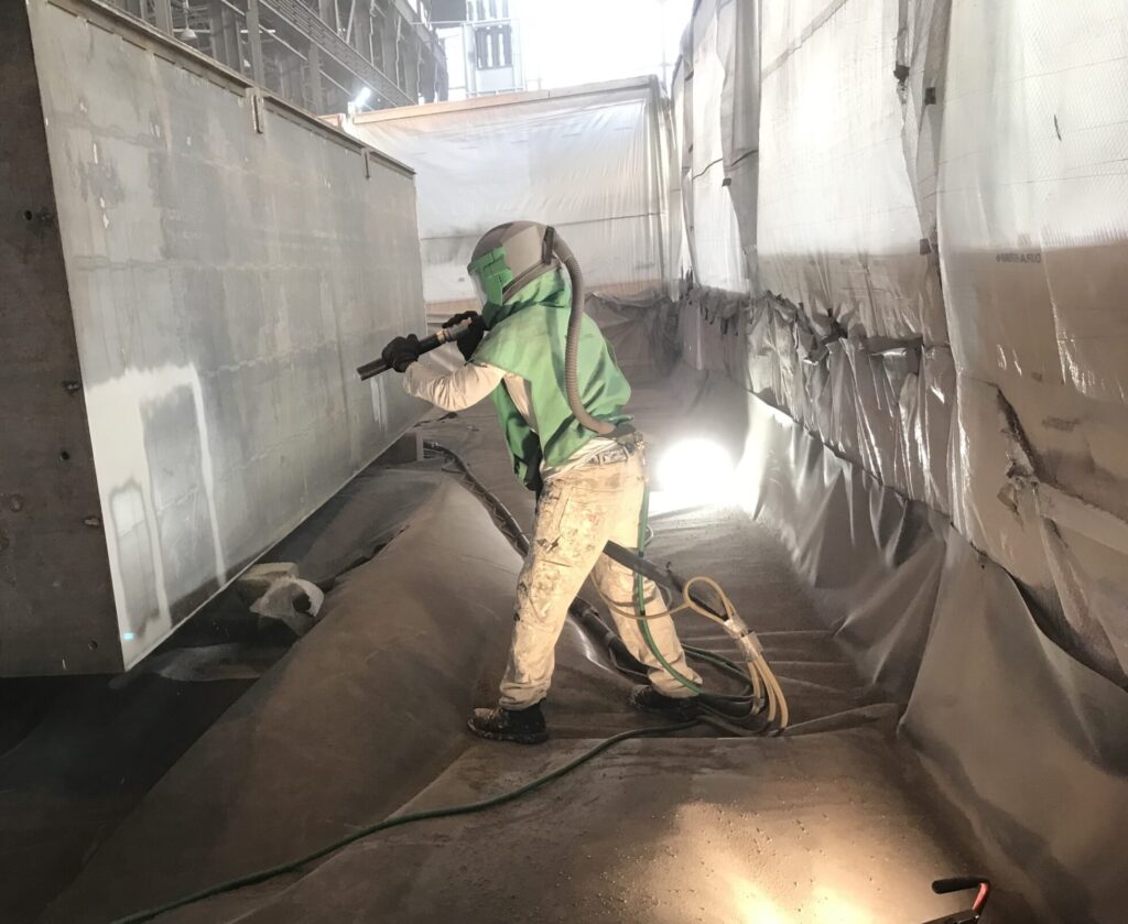 Professional Dry Blasting a Wall at GFS Steel