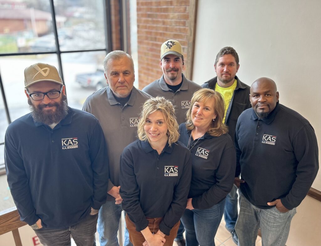 K.A. Sodders Office Staff from left to right: Henry Potts III, Scott MacMillan, Rae MacMillan, Tom Haaf, Janet Gervas, Brandon McDaniels, & Derek Fairly.